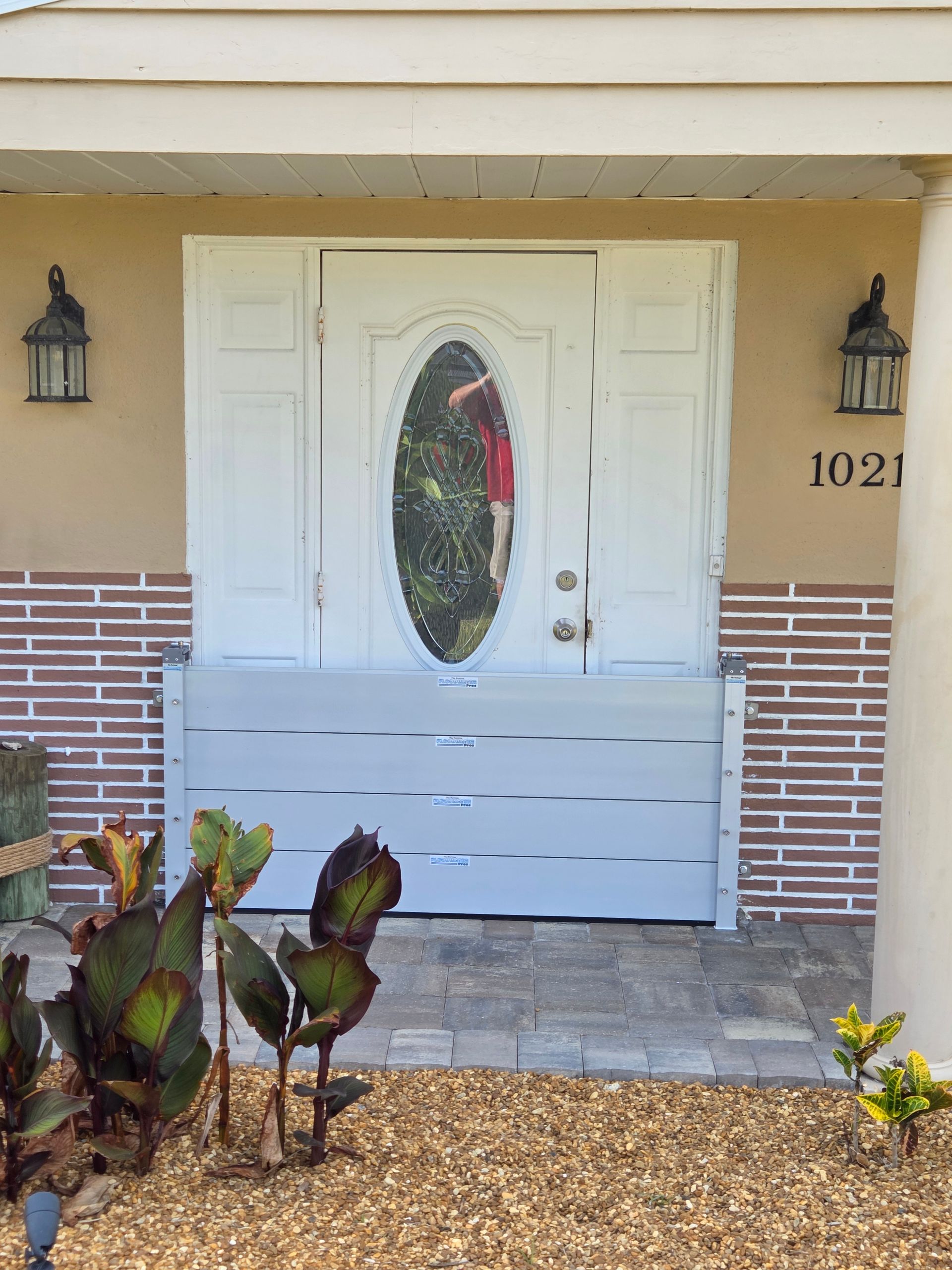The front door of a house with the number 1021 on it