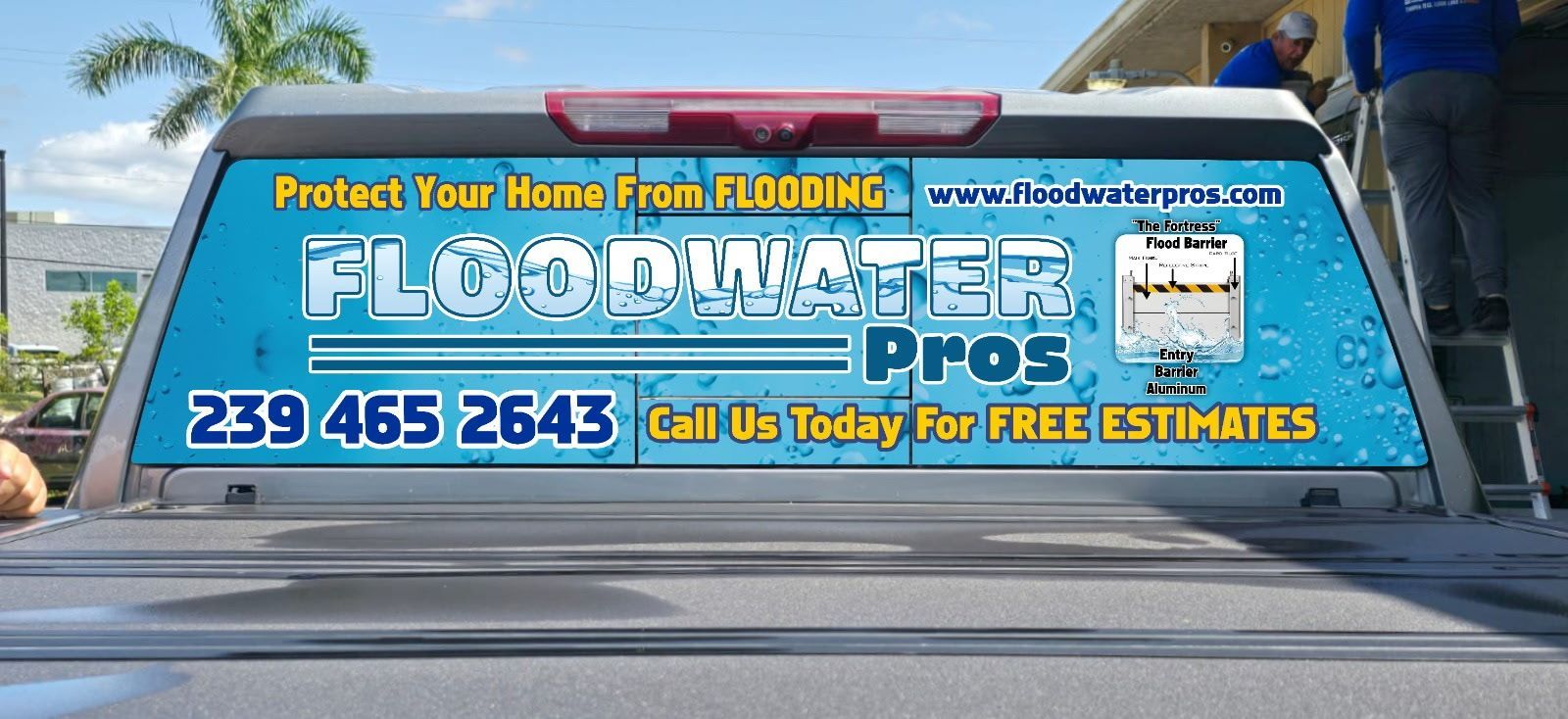 A truck with a sign on the back that says floodwater pros