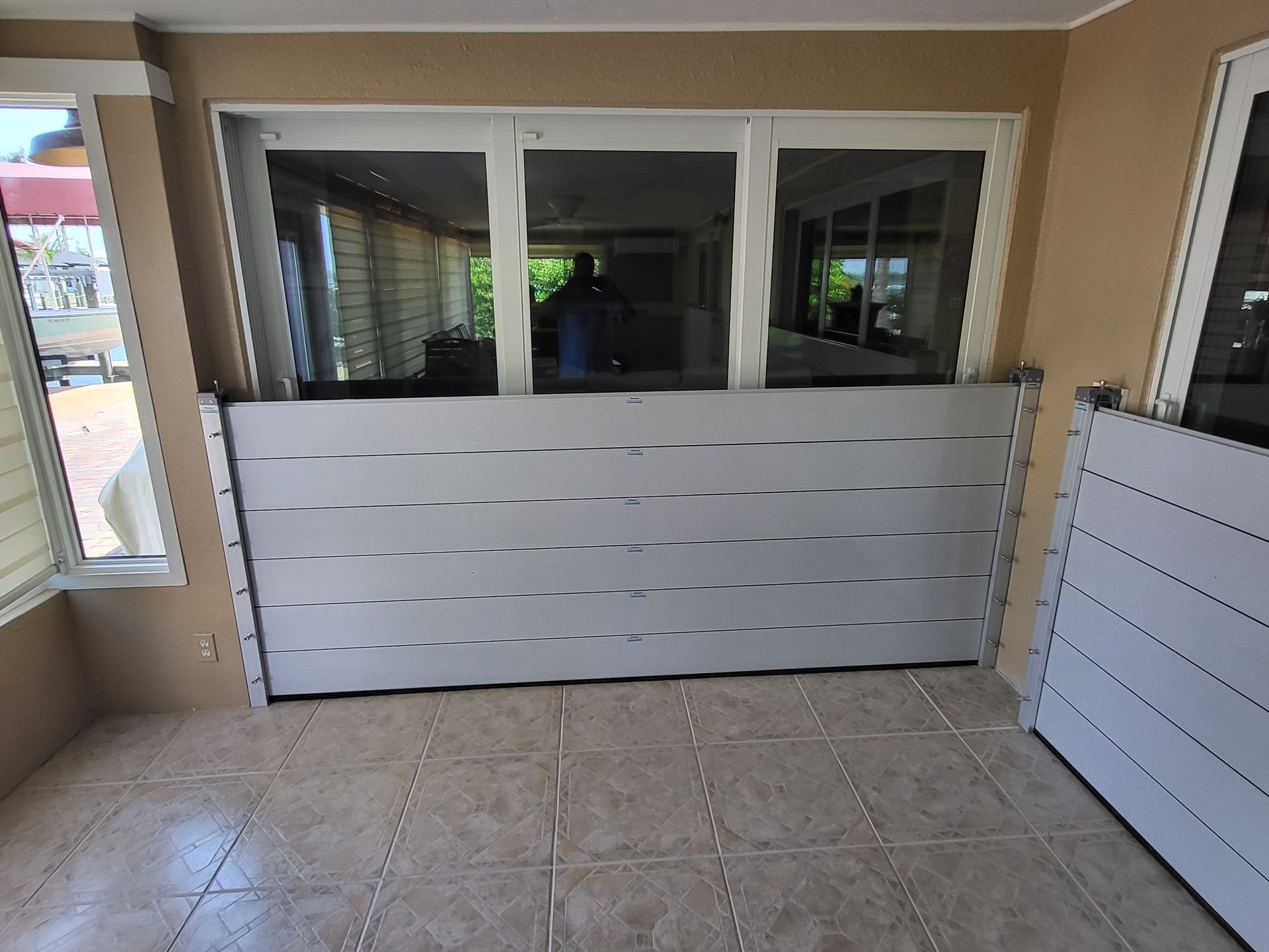 A room with a white door and a window