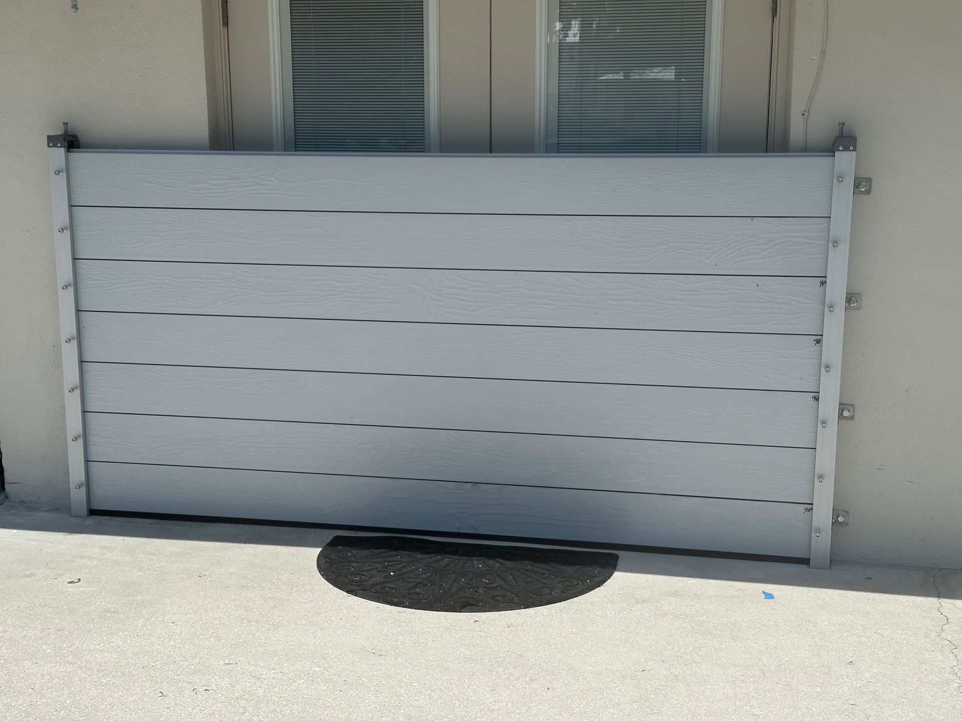 A flood barrier is sitting in front of a house