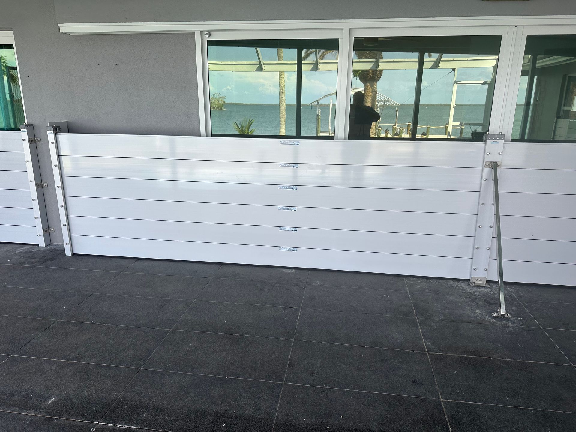 A white barrier is sitting in front of a building