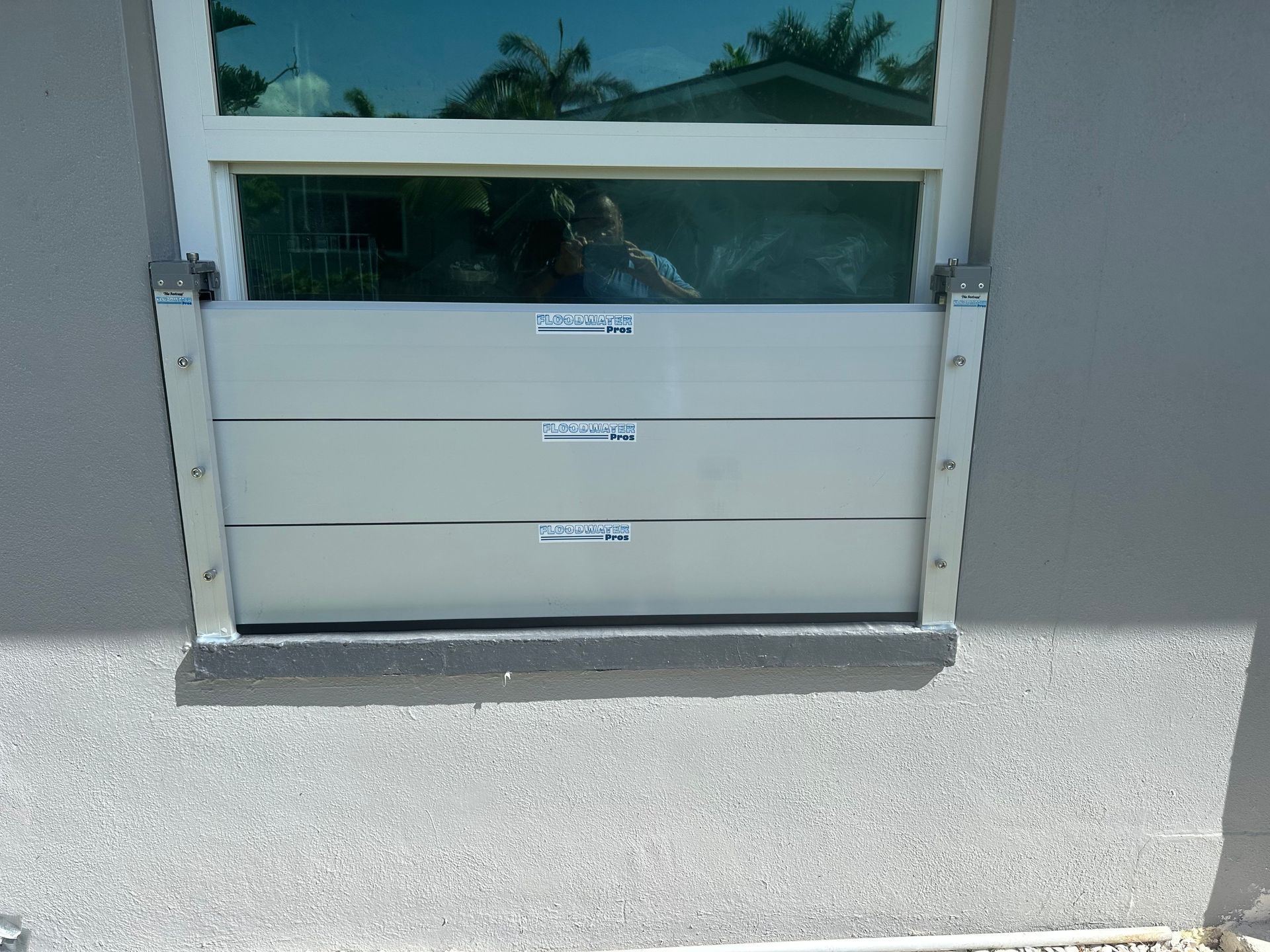 A window with a flood barrier attached to it