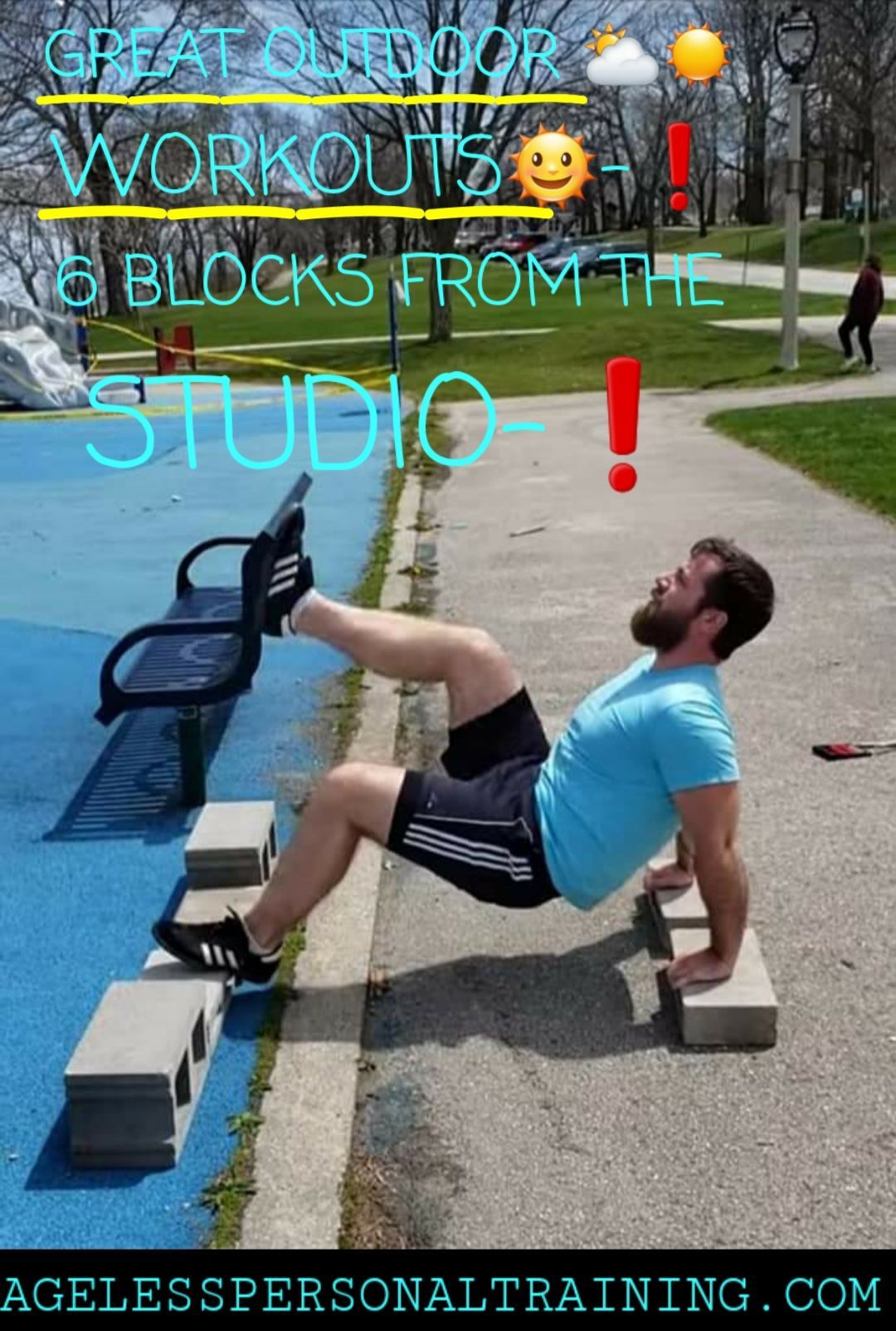 A man is doing exercises on blocks in a park.