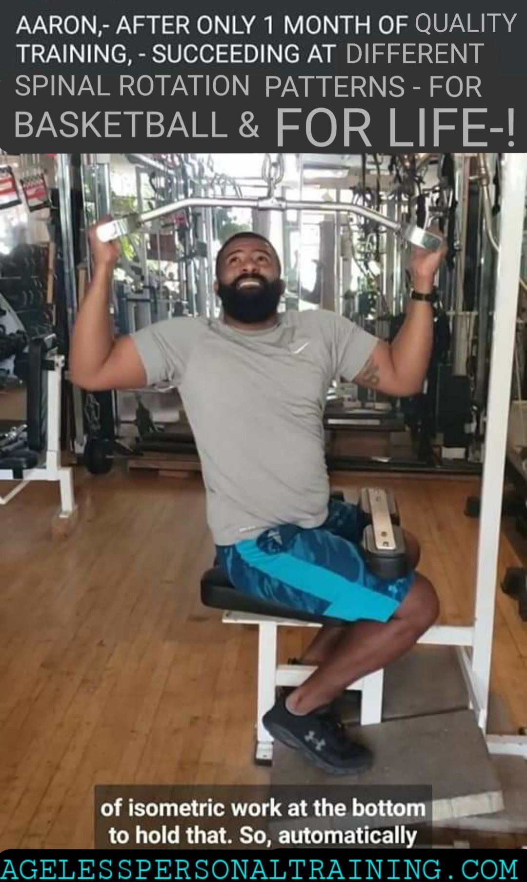A man with a beard is sitting on a bench in a gym.