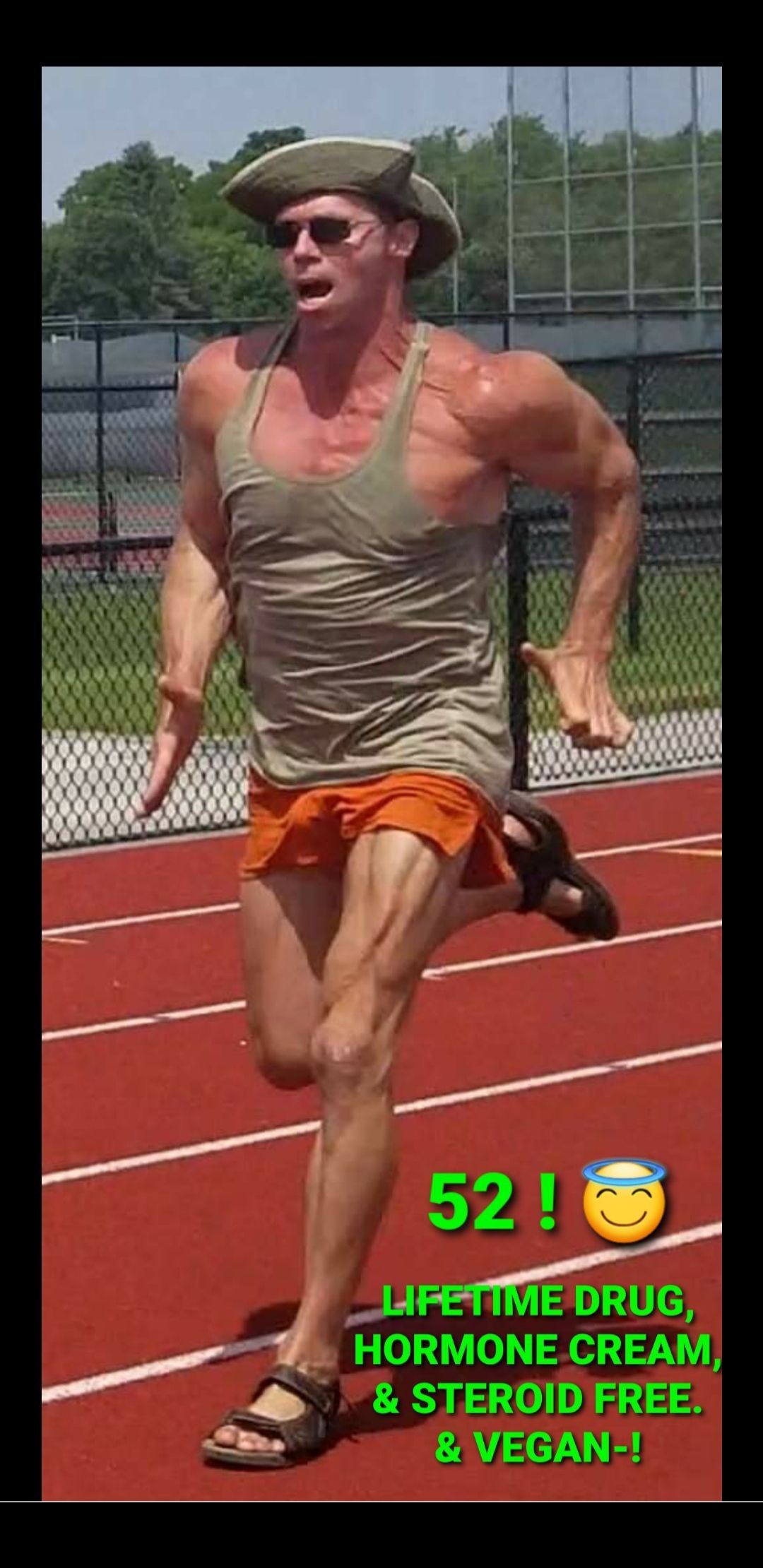 A man running on a track with the number 52 on it