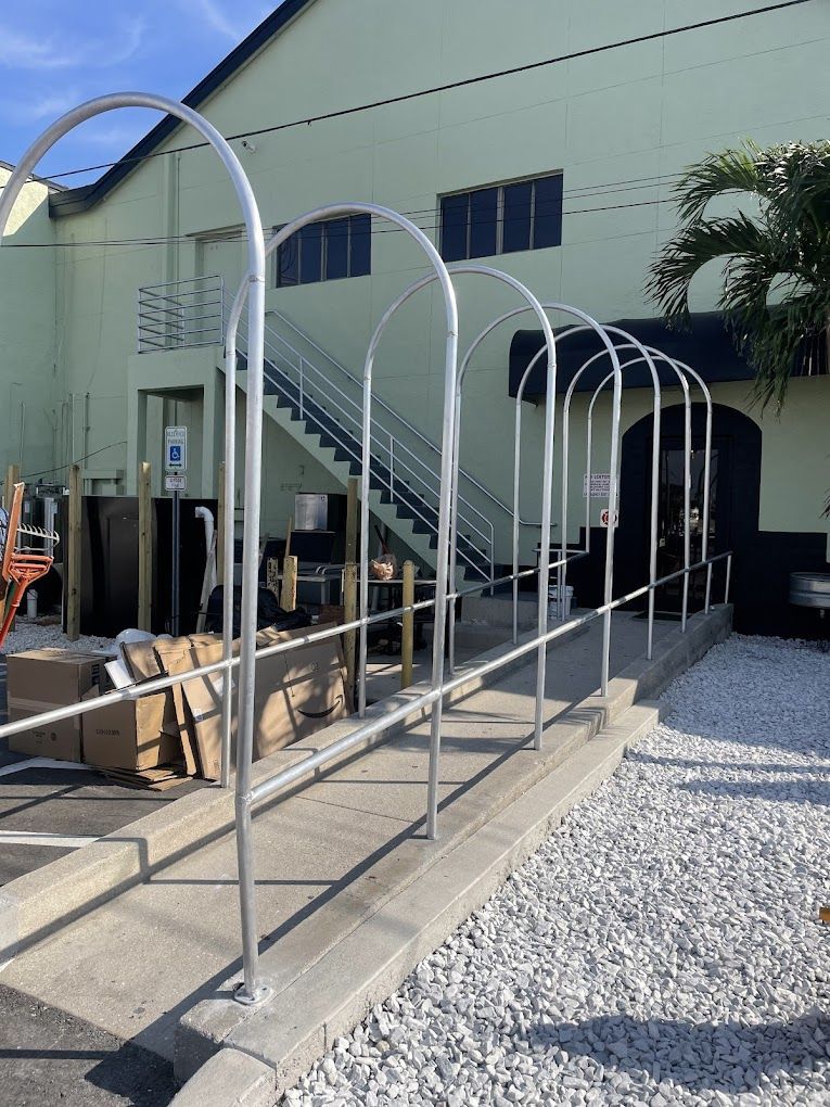 A building with a staircase and a fence in front of it