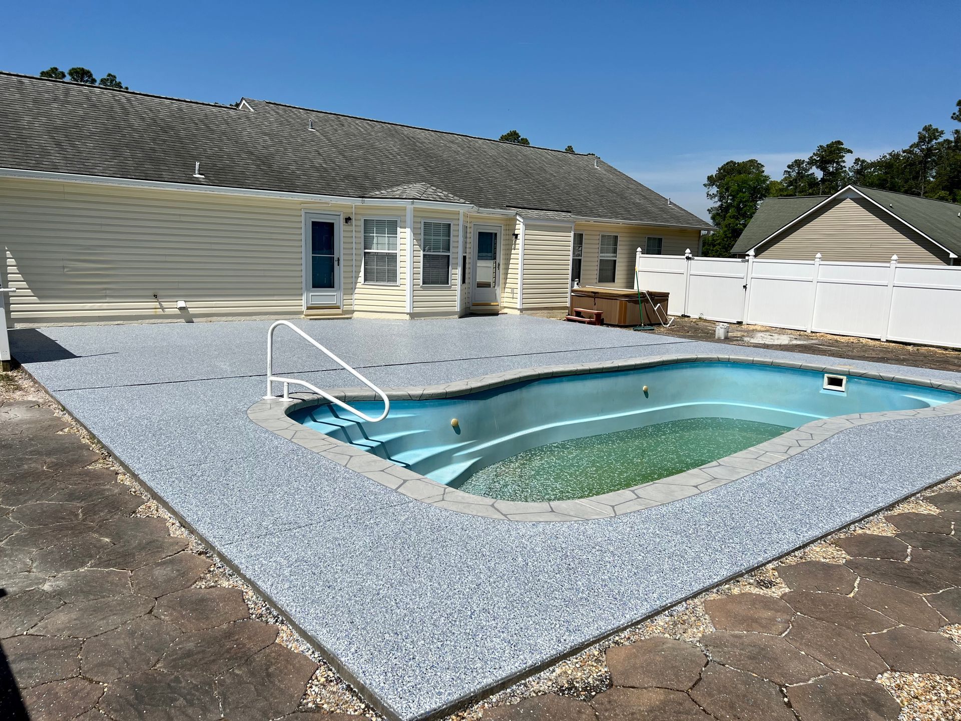 Blueish Coating With House | Morehead City, NC |  Platinum Decorative Concrete Coatings