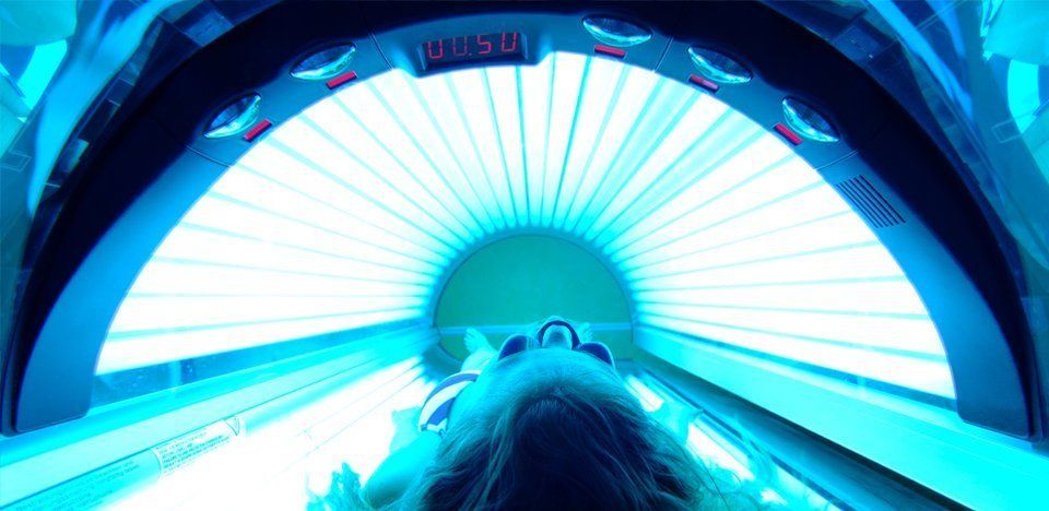 Woman tanning in a sunbed