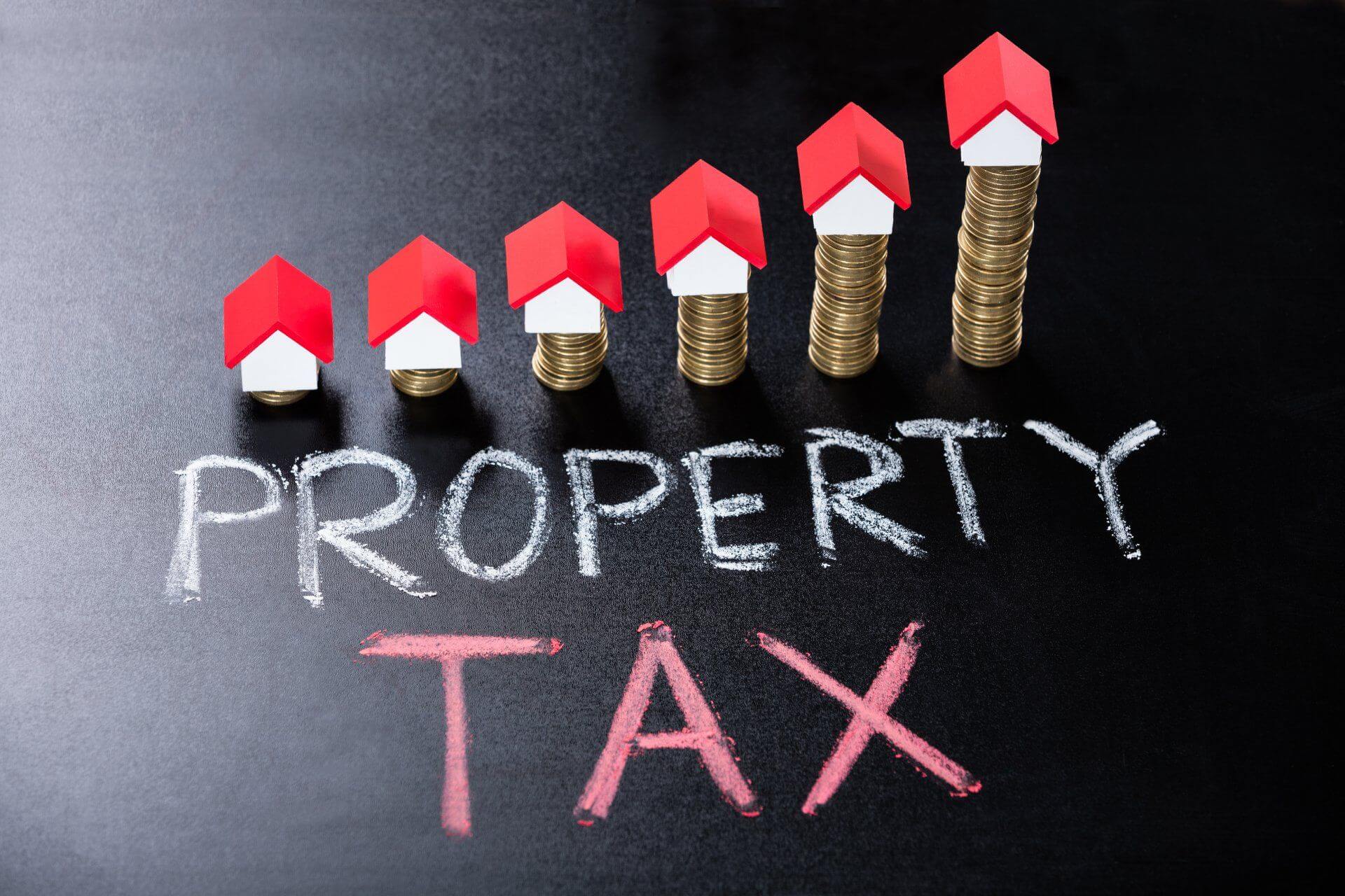WWL Property Lawyers - Property Tax Image of a House on top of money