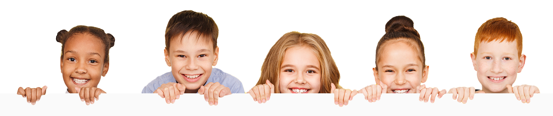 Five diverse children smiling and holding onto a white surface.