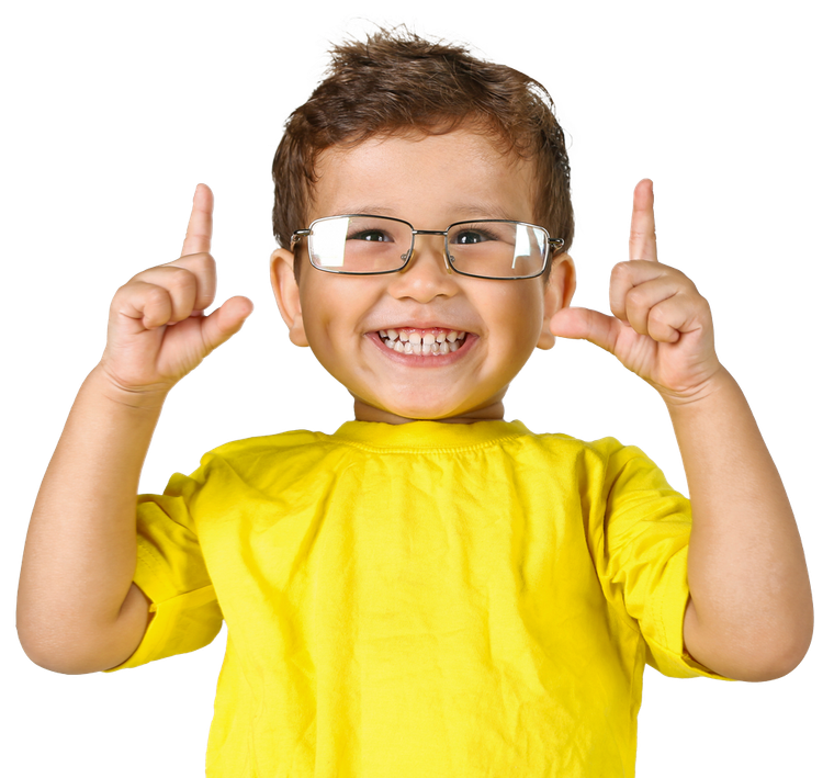 Smiling child with glasses, pointing up with both index fingers, wearing a yellow shirt.
