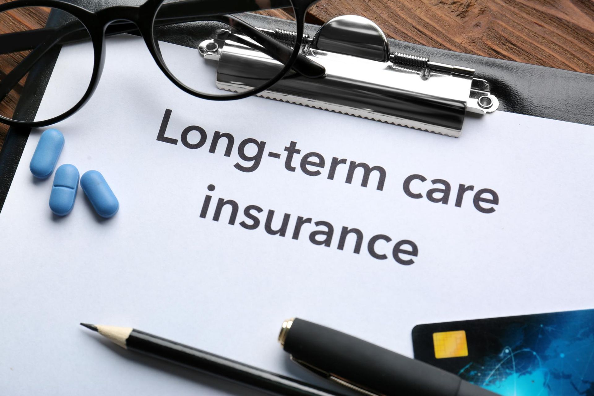 A clipboard with the words long-term care insurance written on it.