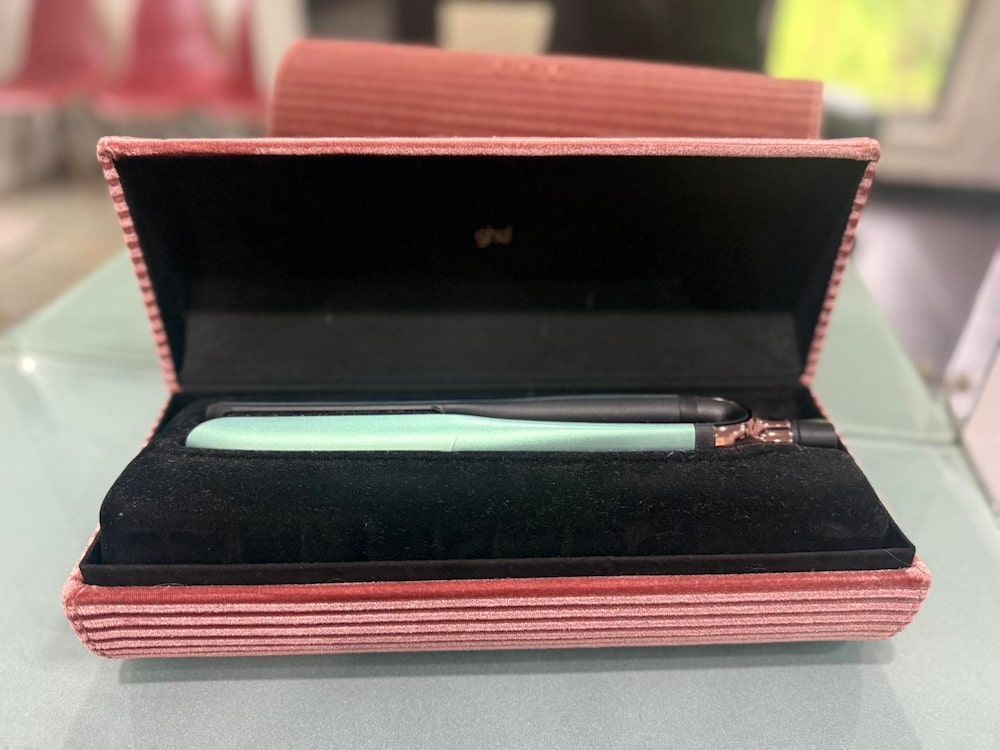 A Pen In A Pink Case Is Sitting On A Table — Sarina Hair Fashions in Sarina, QLD