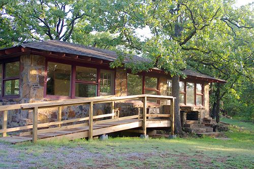 A house with a wooden ramp leading to it