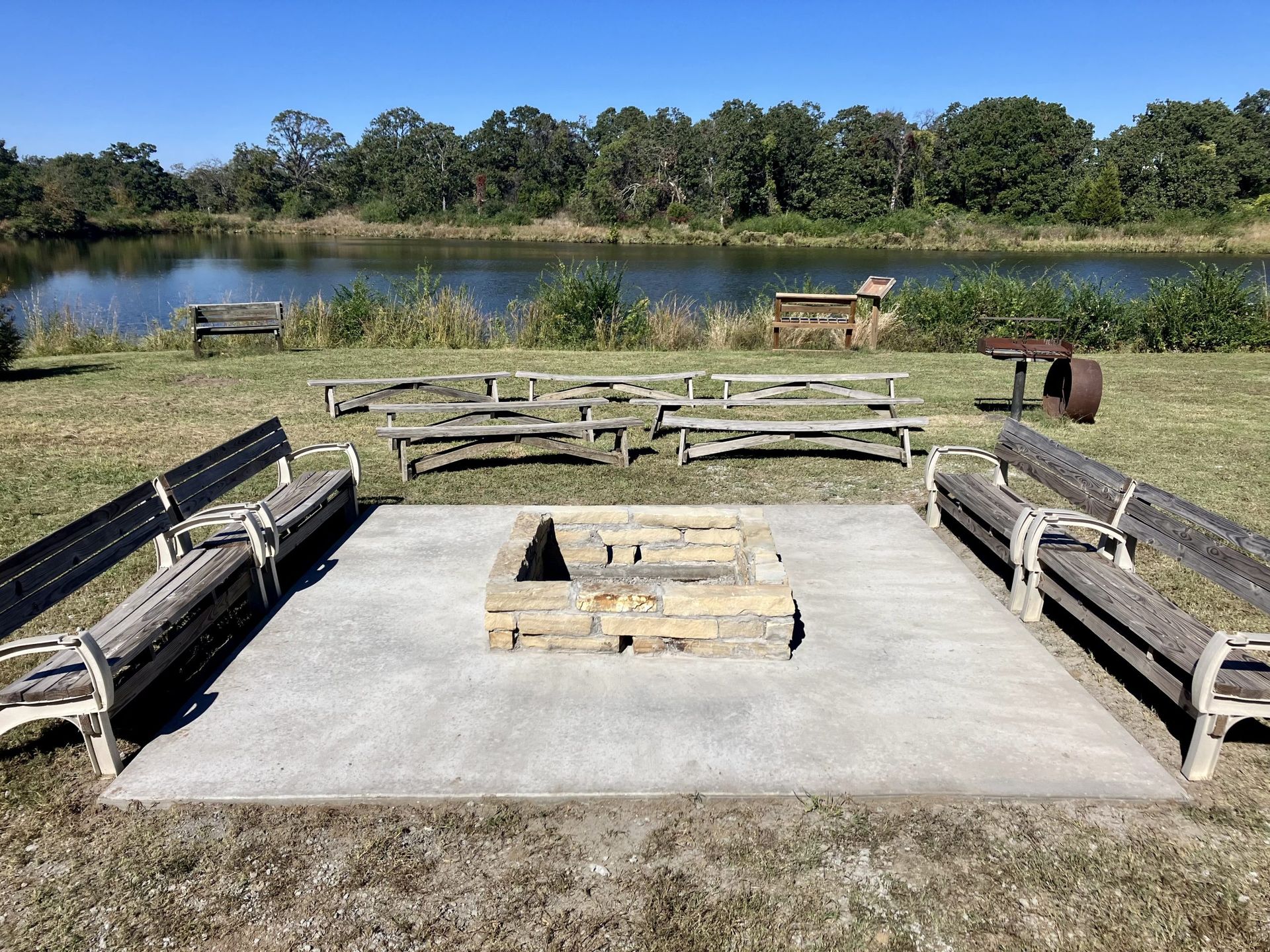 fire pit with lake view at Camp Loughridge in Tulsa Oklahoma