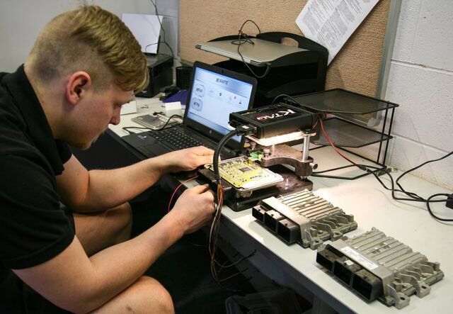 man working on electronics