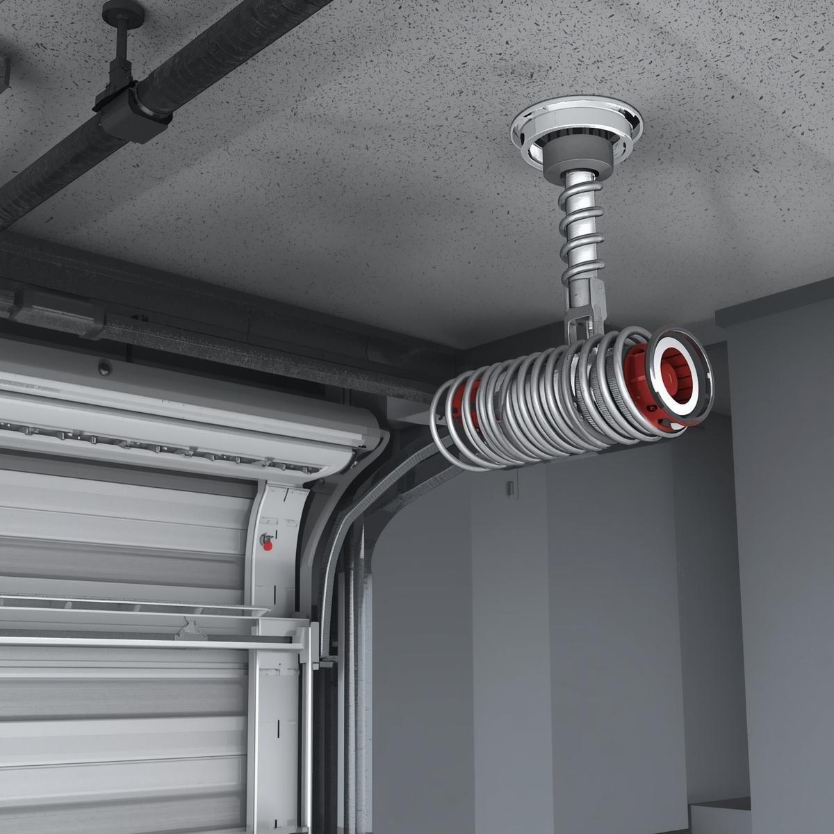 Coiled ventilation duct hanging from a concrete garage ceiling beside a garage door