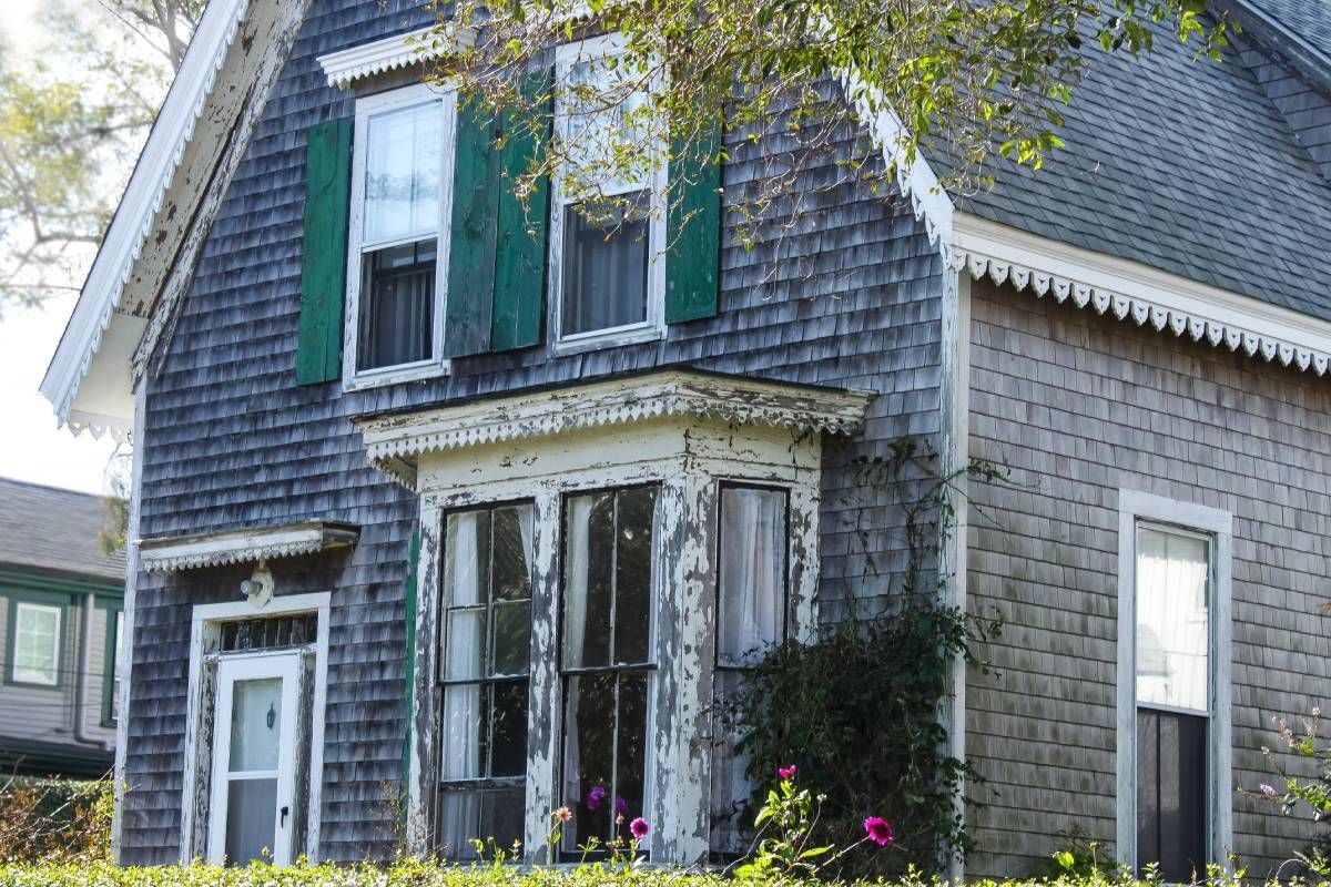 A distressed blue two-story house near Lexington, KY