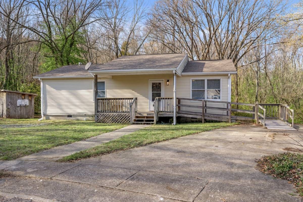 A house with yellow siding and wheelchair ramp near Lexington, KY