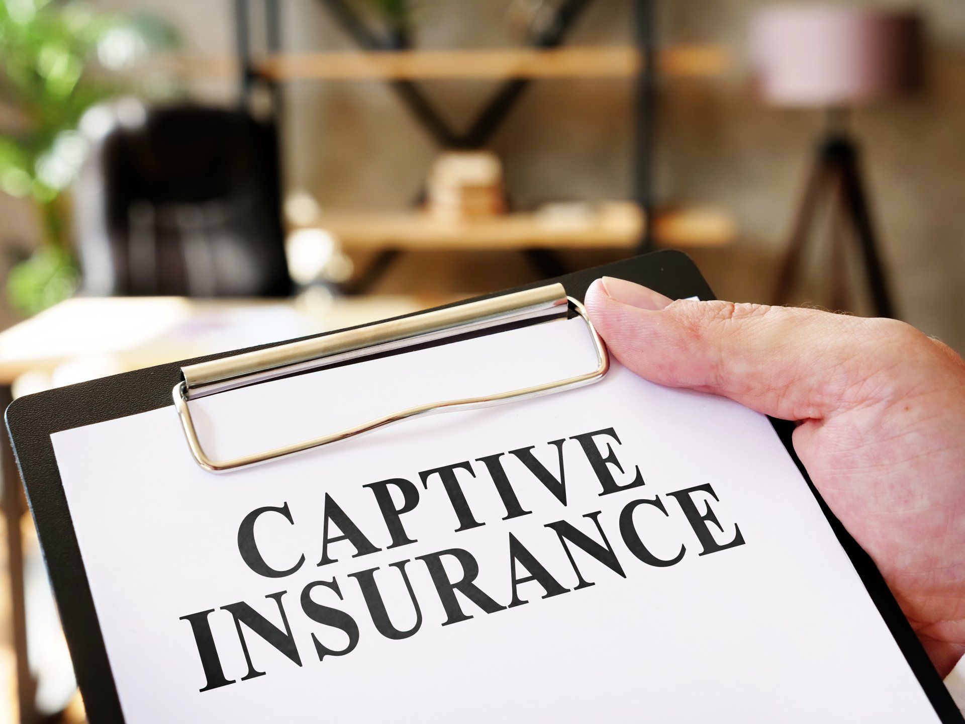 Captive Insurance on clipboard