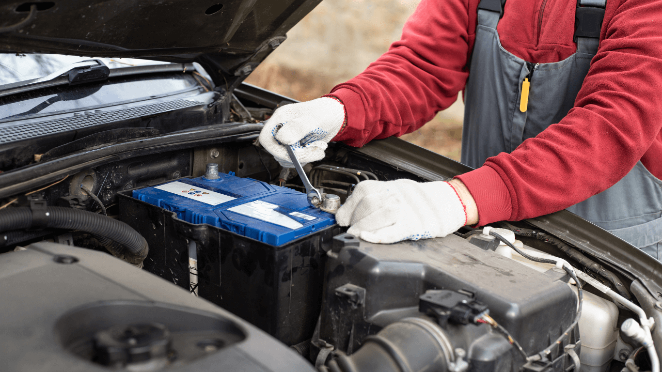a mechanic doing a battery replacement