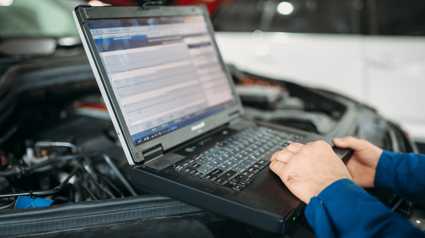 a mechanic doing a vehicle diagnostic evaluation