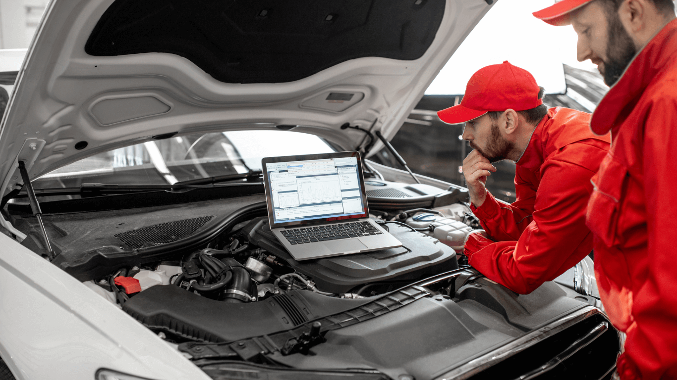 mobile mechanics doing a vehicle diagnostic