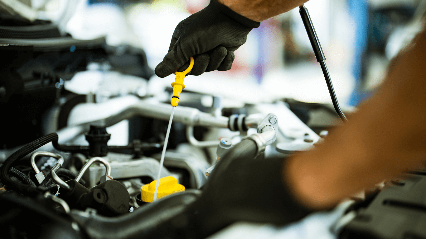 a mechanic doing an oil change