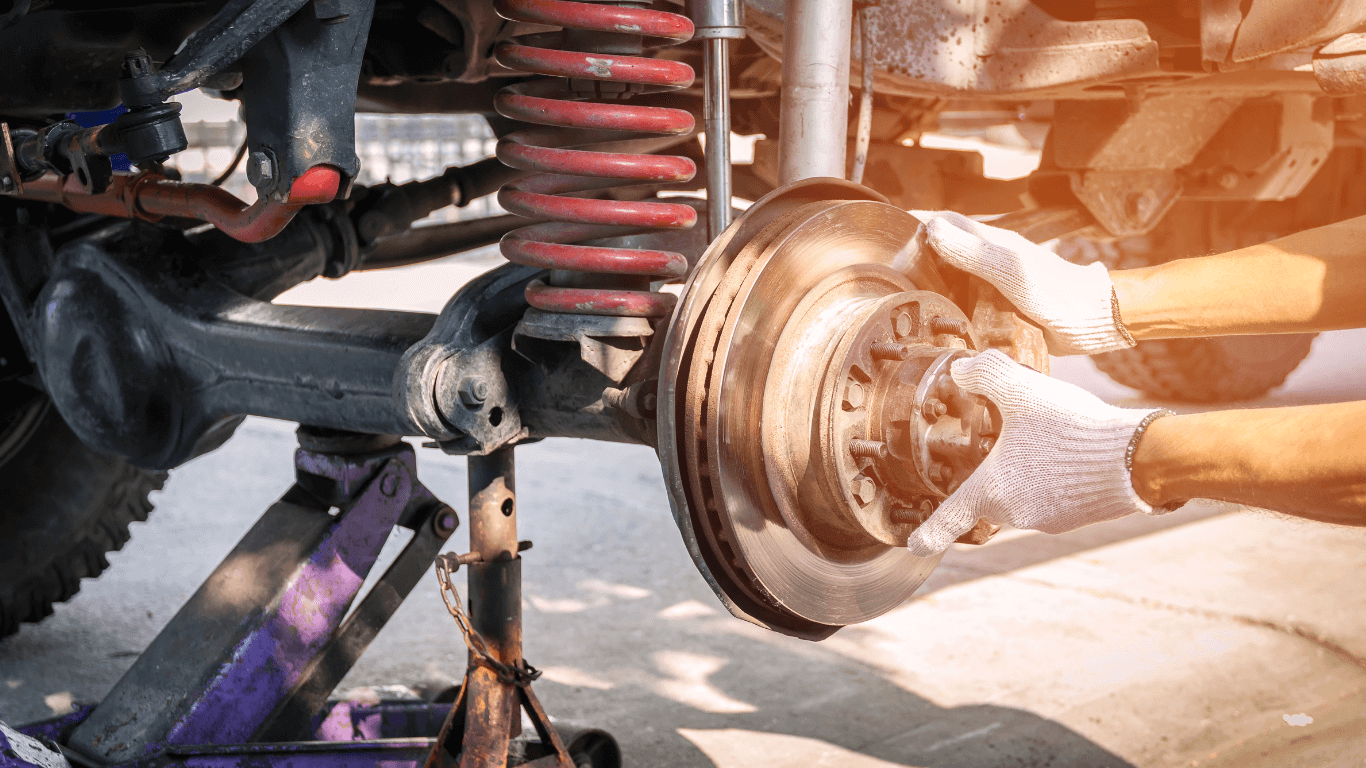 a mechanic doing suspension repair
