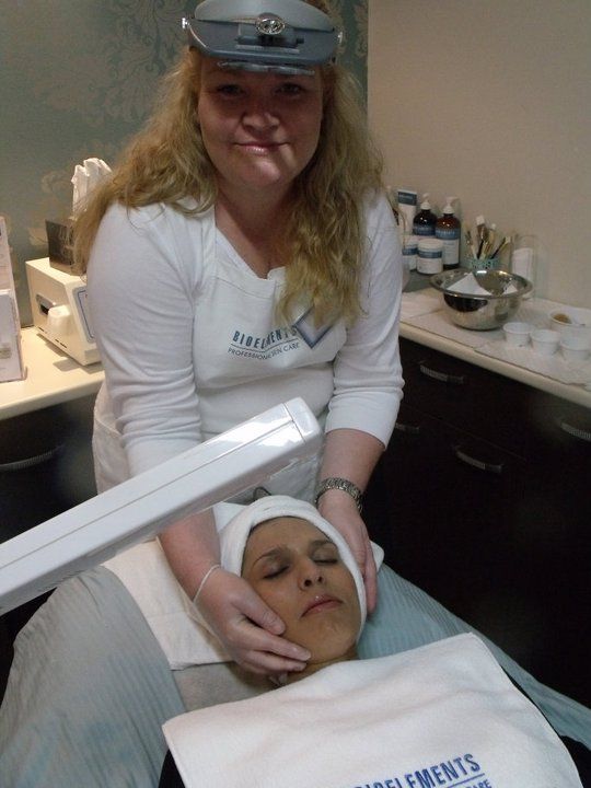 A woman in a white shirt with the word supplements on it