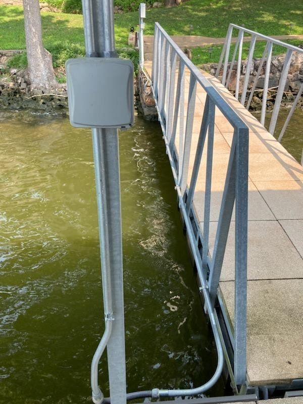 A bridge over a body of water with a box on it