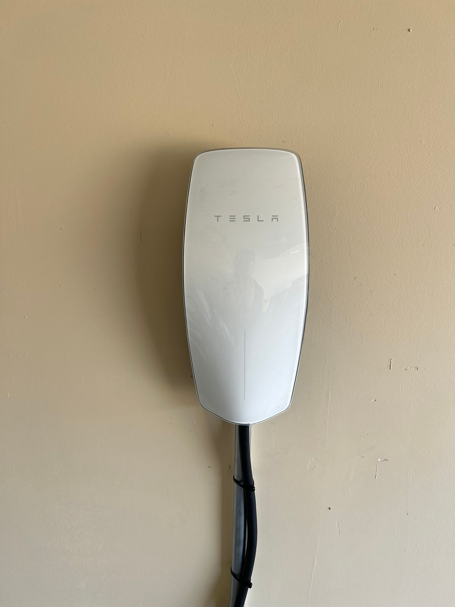 A Tesla residential EV charger