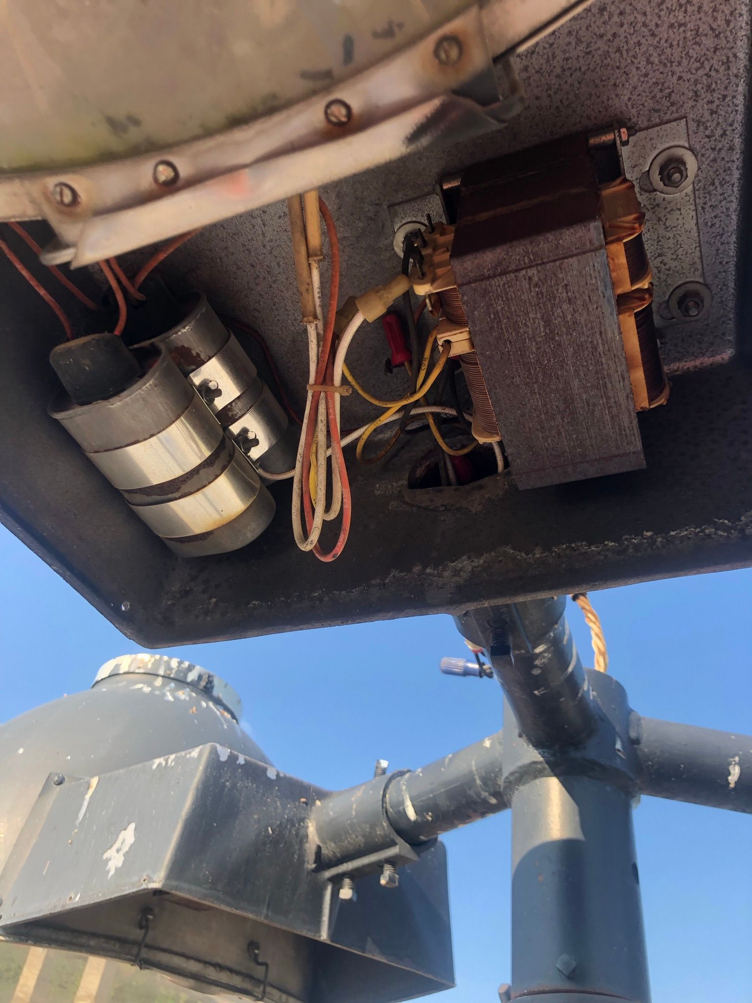 A close up of the inside of a building with a blue sky in the background