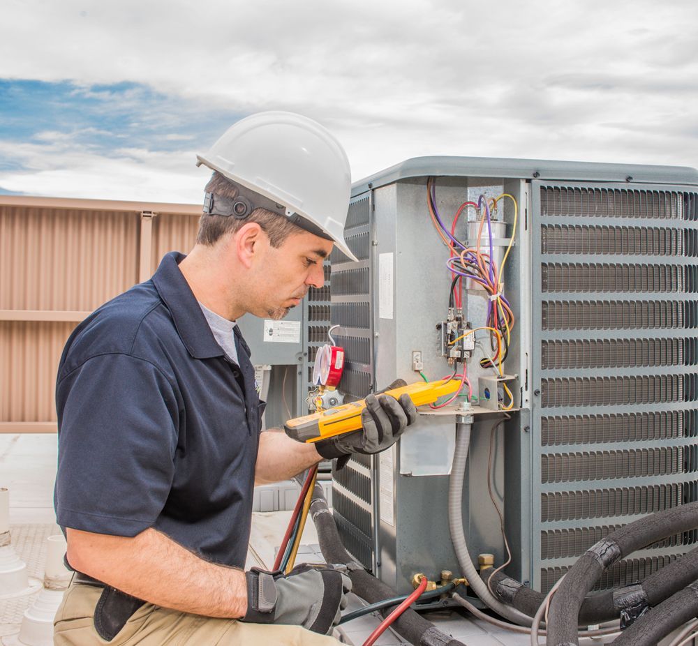Professional Worker Installing Commercial Air Conditioning Unit