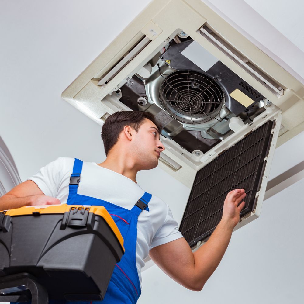 Professional Worker Installing Commercial Air Condition