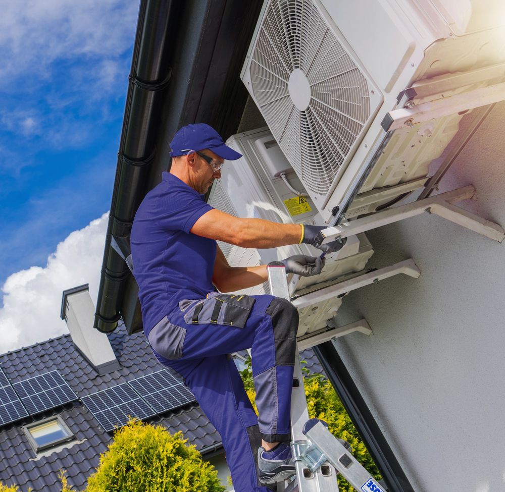 Professional Worker Installing Residential Air Conditioning Unit