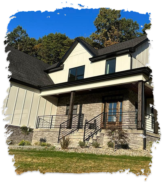 A white house with a black roof and a porch