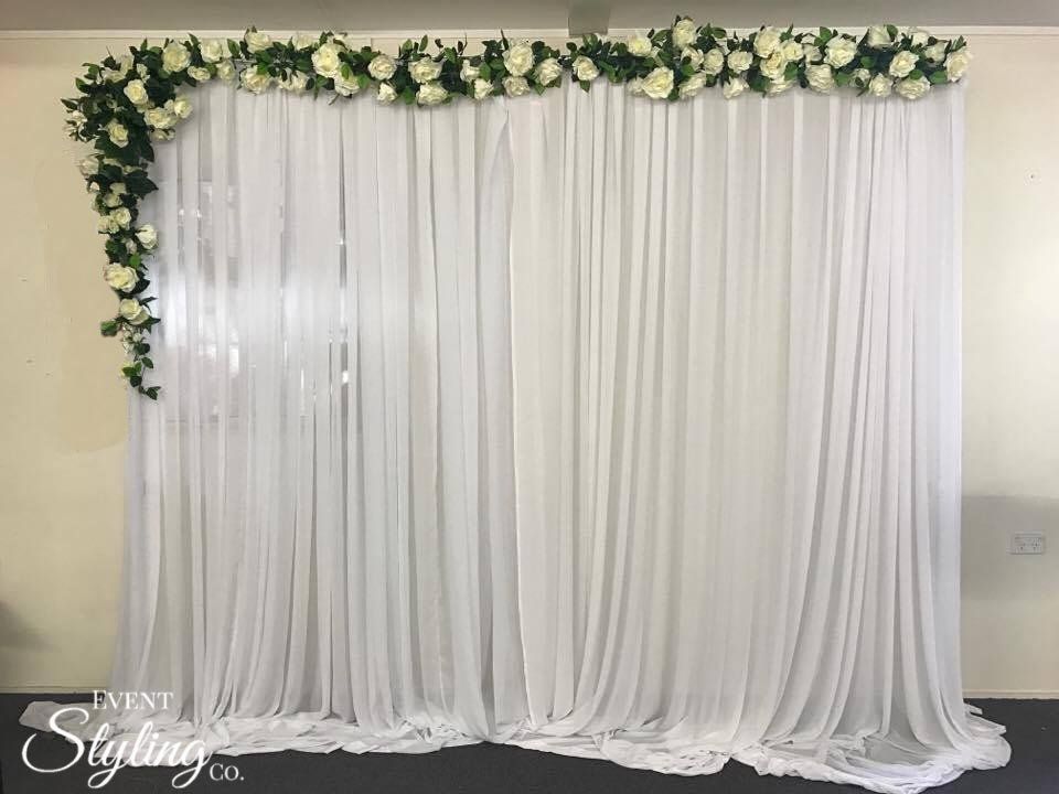 White chiffon draping with flower garland