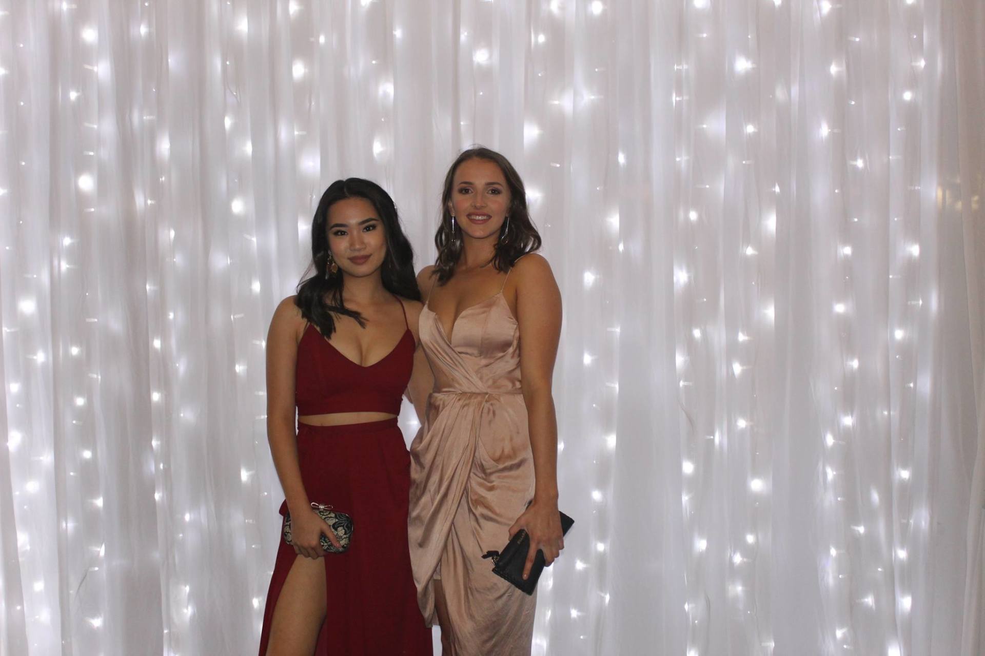 White Fairy curtain shown with white chiffon wall drapes on either side and wall wash lights 9 meters wide.Hire price from $500 incl installation, pick up & gst