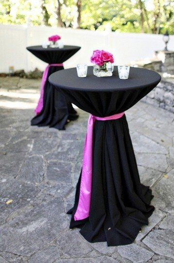 Bar leaner dressed in Black Table cloth with Pink sash