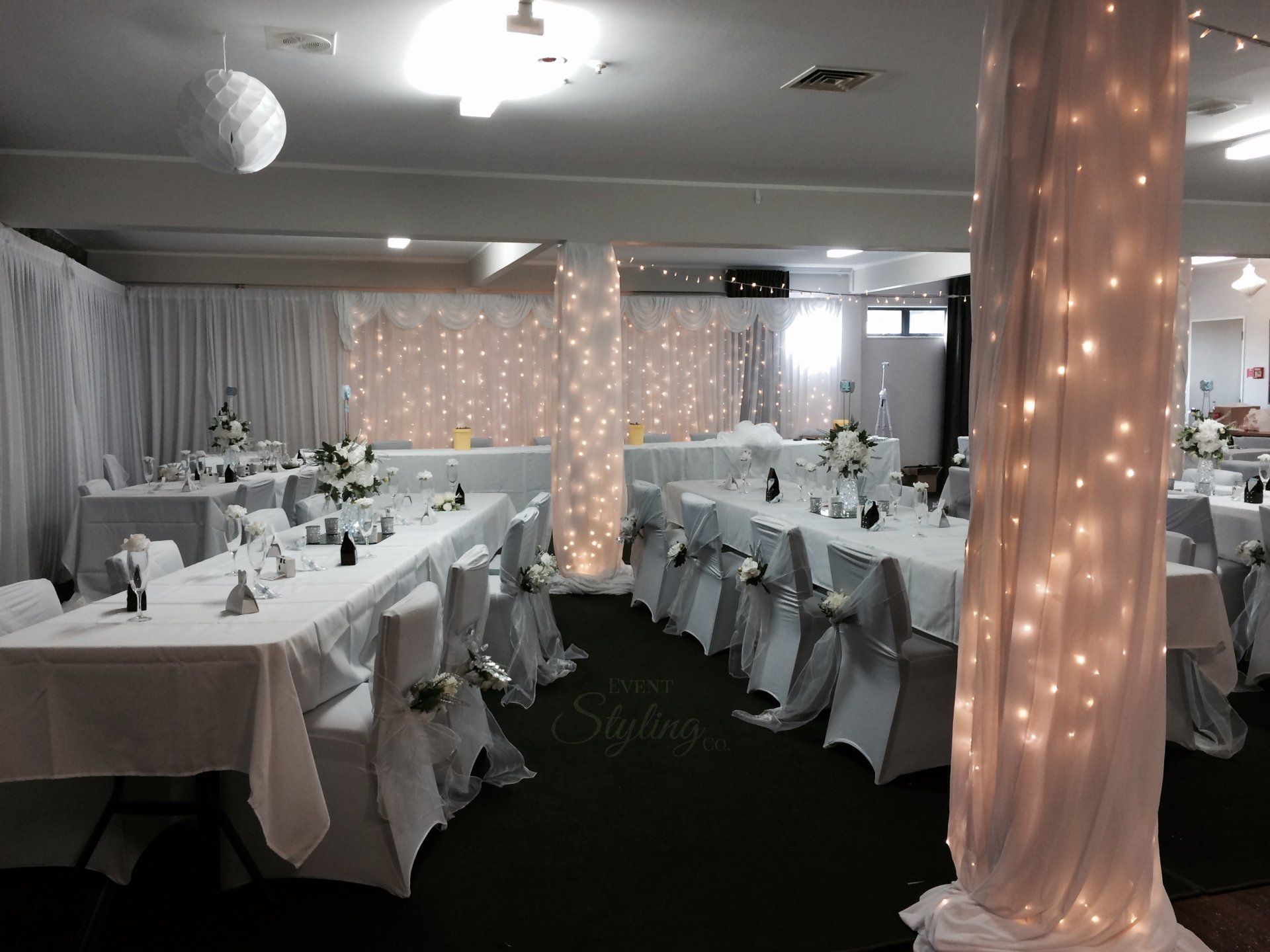 White fairy curtain and Pillar draping and fairy lighting