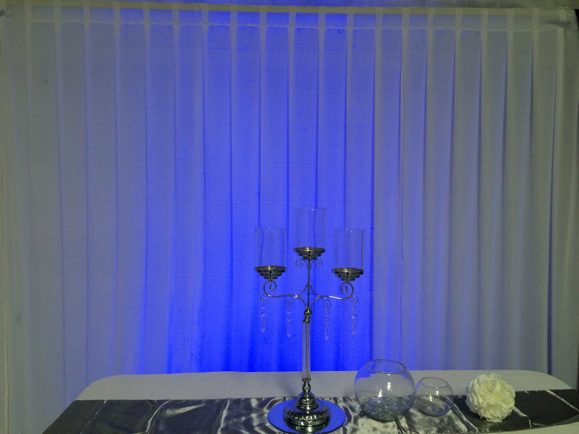 White Chiffon drape with blue wall wash