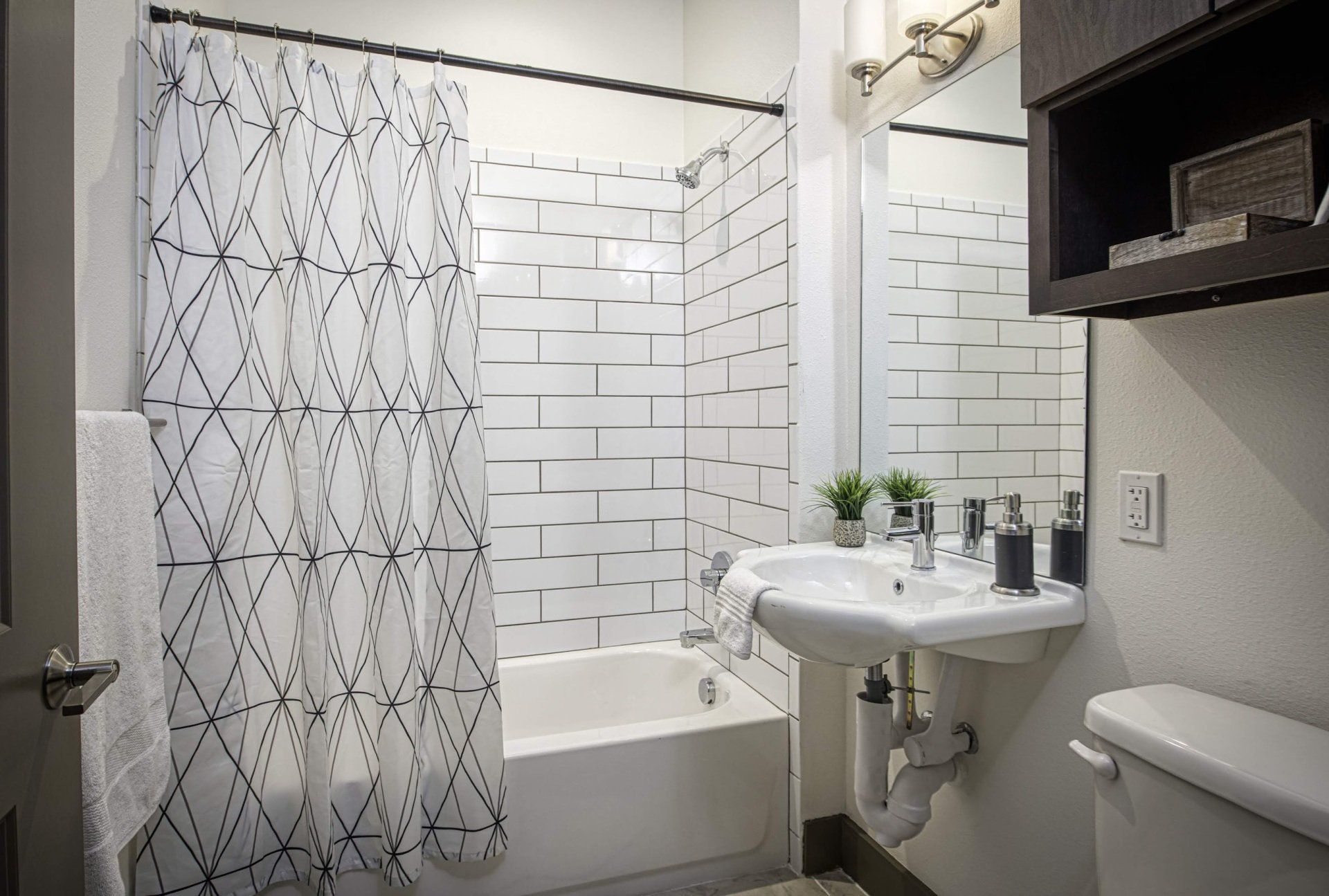 Photo showing a bathroom with a fountain-like sink and a shower/bathtub combo