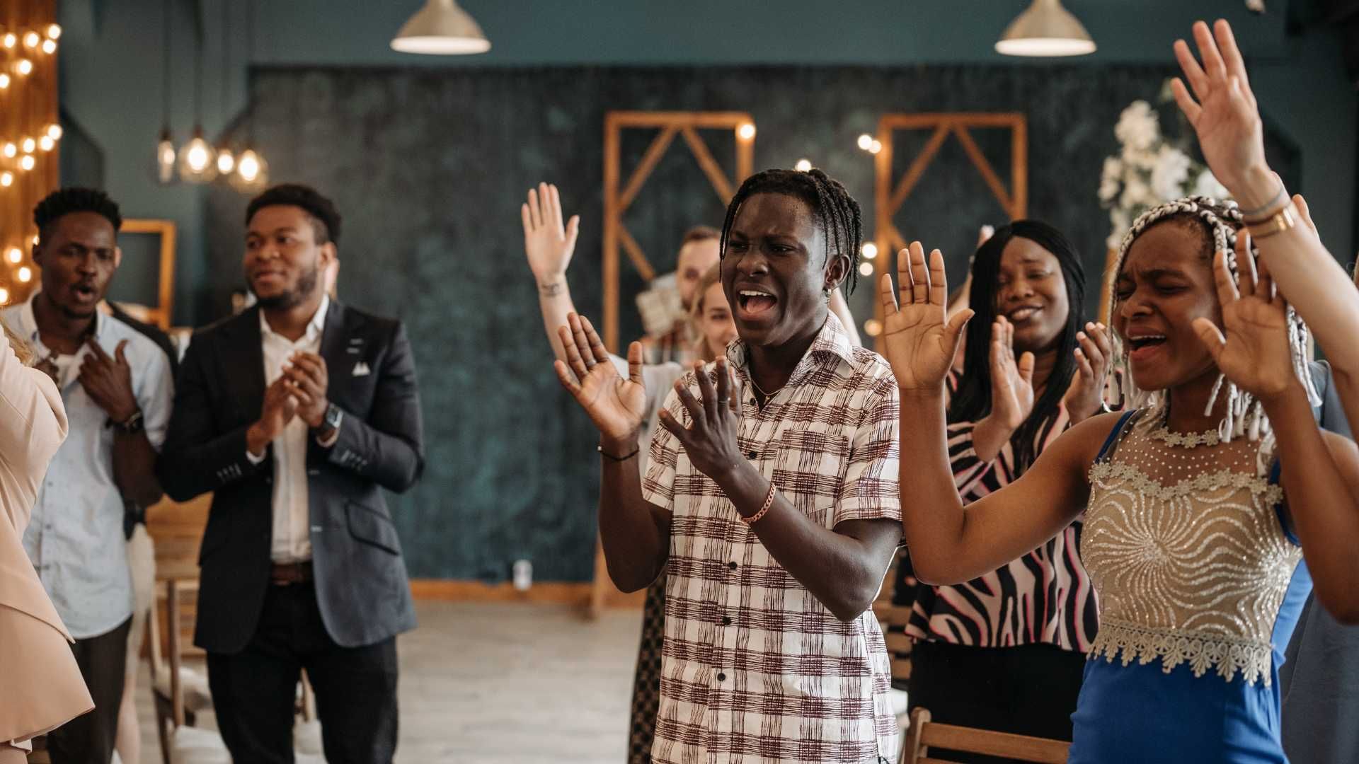 a group of well-dressed churchgoers worshipping