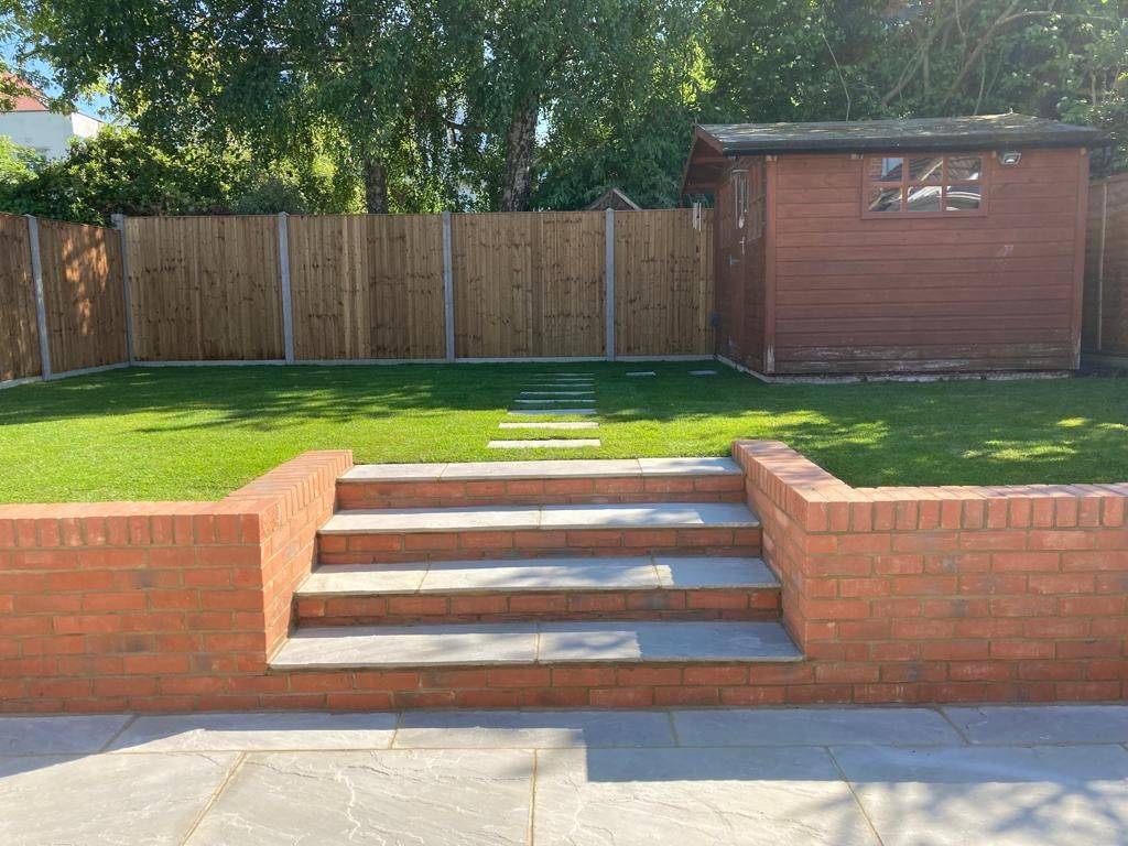 garden wall and paving and lawn and fences