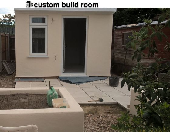 A custom build room is being built in a back garden