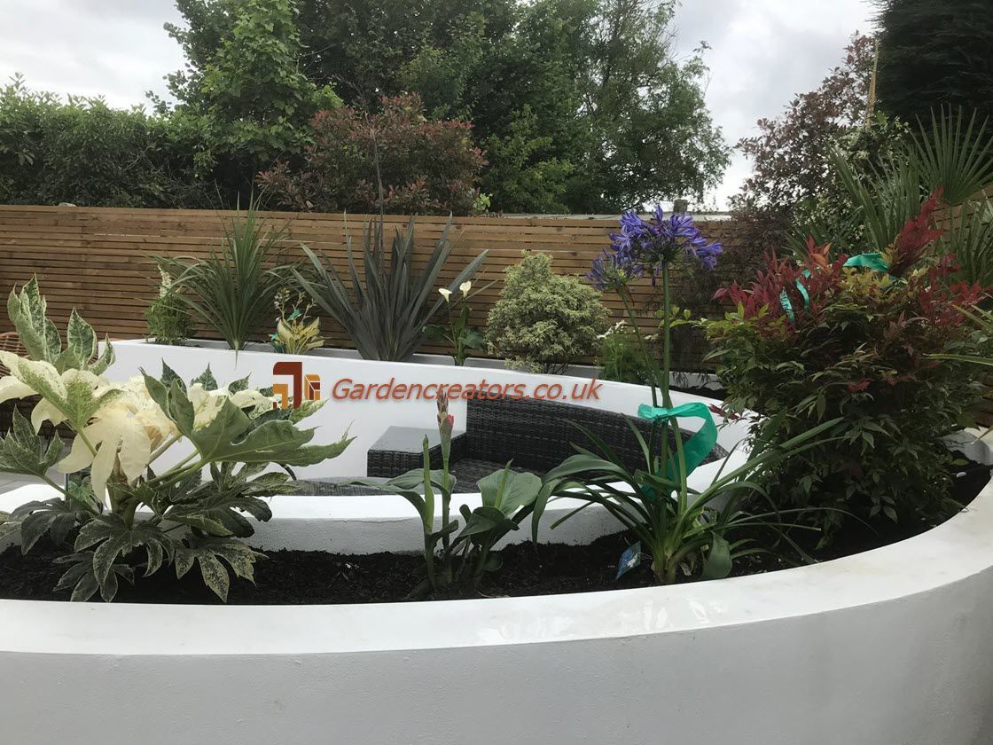 curved raised planter & sitting area