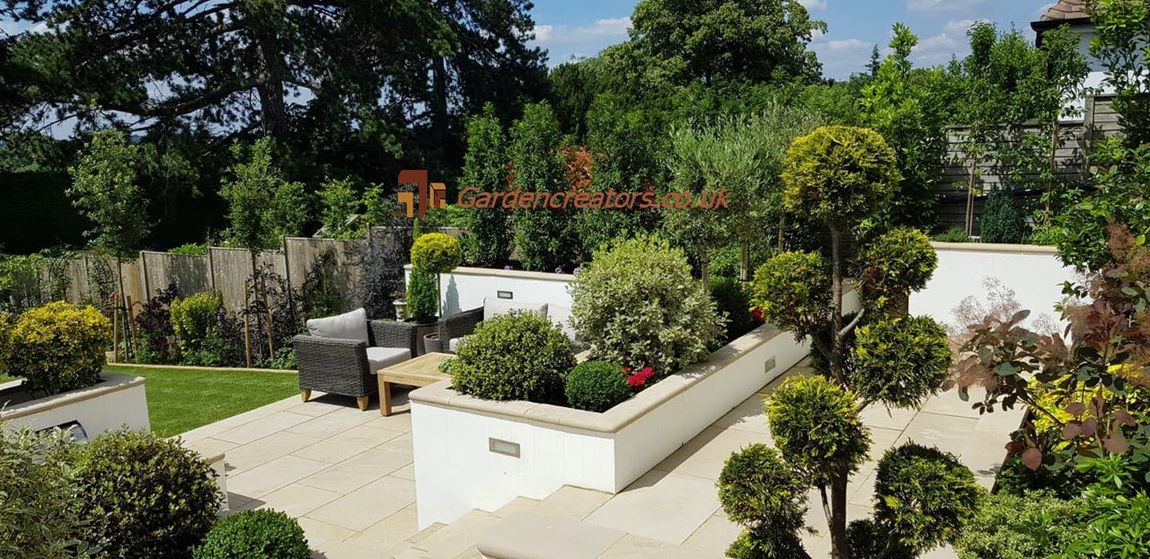 raised concrete planters, paving patios, design & built, mature plants, lighting