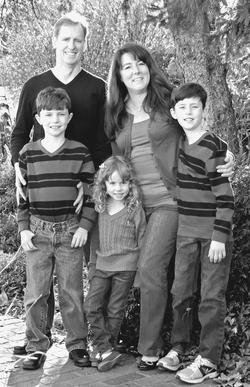 Photo of Paul Wheeler with his wife and three children
