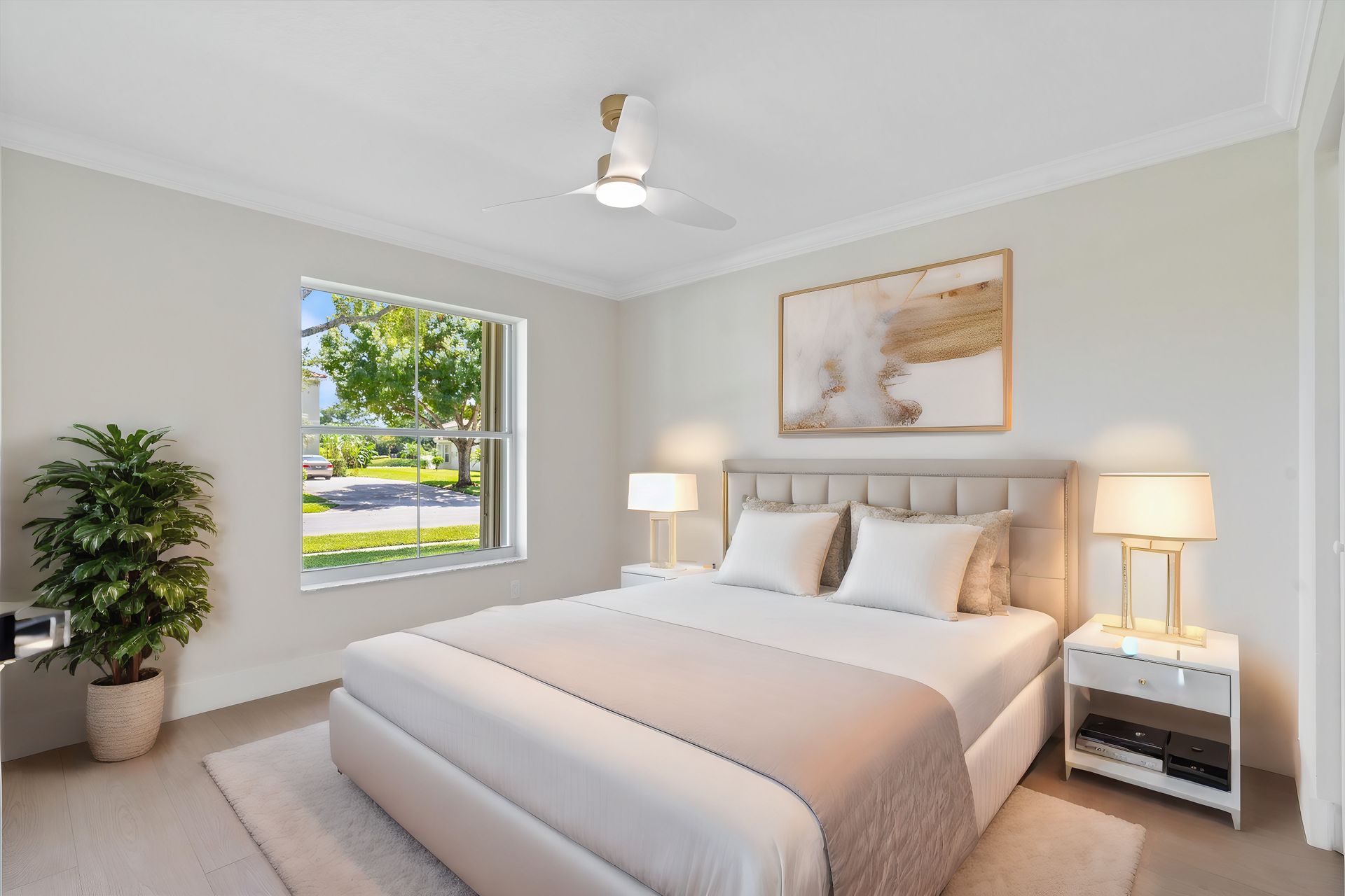 A bedroom with a large bed and a window.